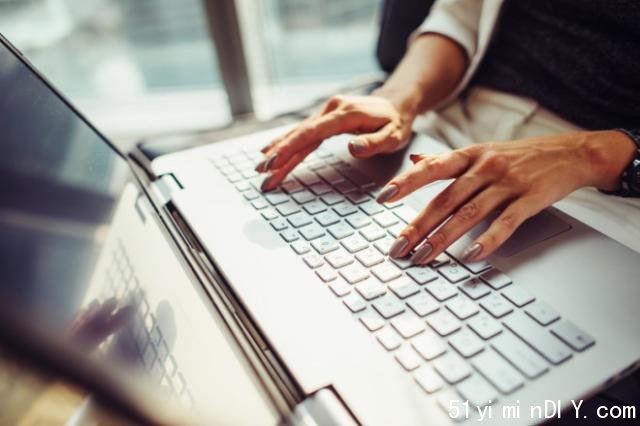 hands typing on a keyboard