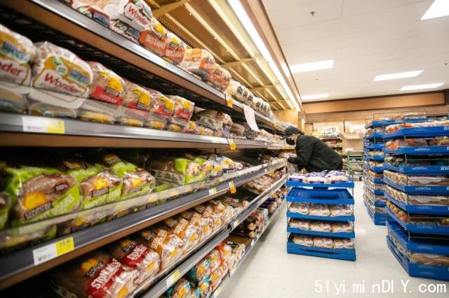 Canada Bread Co. will pay a fine of million after pleading guilty to its role in a criminal price-fixing arrangement that raised the wholesale price of fresh commercial bread. A worker restocks shelves in the bakery and bread aisle at an Atlantic Superstore grocery in Halifax, Friday, Jan. 28, 2022. THE CANADIAN PRESS/Kelly Clark